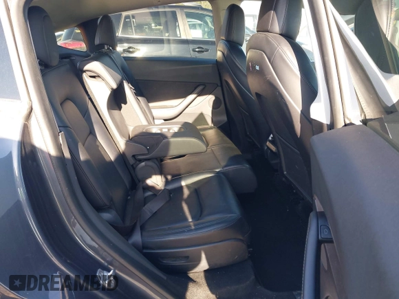 2021 Tesla Model Y Long Range with VIN 5YJYGAEE1MF149887, listed as a IAAI auction lot 42032104 with 54,932 mi miles. Bid and sale history available at carsss.com. Image 8.