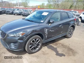 2016 Mazda CX-5 Grand Touring z VIN JM3KE4DY1G0893119, wystawiony jako IAAI lot #42049614 z przebiegiem 102 506 mil mil oraz . Historia ofert i sprzedaży dostępna na DreamBid. Obrazek 6.