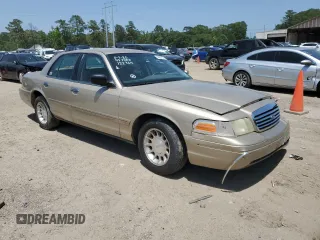 1999 Ford Crown Victoria LX z VIN 2FAFP74W1XX122364, wystawiony jako Copart lot #56929455 z przebiegiem 118 134 mil mil oraz Szkody całkowita. Historia ofert i sprzedaży dostępna na DreamBid. Obrazek 4.