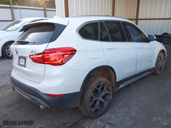 2018 BMW X1 xDrive28i with VIN WBXHT3C32J5K29627, listed as a IAAI auction lot 40995212 with 64,162 mi miles. Bid and sale history available at carsss.com. Image 4.