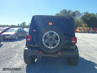 2019 Jeep Wrangler Unlimited Sahara with VIN 1C4HJXEG0KW604937, listed as a IAAI auction lot 40931379 with 94,821 mi miles. Bid and sale history available at carsss.com. Image 16.