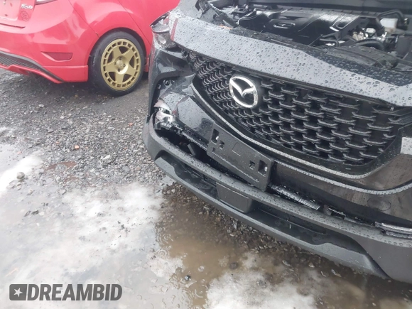 2025 Mazda CX-50 S Preferred z VIN 7MMVABBM4SN306171, wystawiony jako IAAI lot #41037323 z przebiegiem Nie podano mil oraz . Historia ofert i sprzedaży dostępna na DreamBid. Obrazek 6.