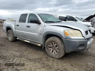 2006 Mitsubishi Raider Duro Cross with VIN 1Z7HC38N76S560403, listed as a Copart auction lot 42801925 with 197,423 mi miles and Salvage Title. Bid and sale history available at carsss.com. Image 4.