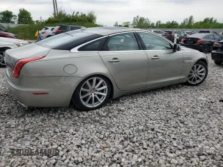 2014 Jaguar XJ z VIN SAJWJ1CD9E8V62338, wystawiony jako Copart lot #58924065 z przebiegiem 60 909 mil mil oraz Czysty tytuł • Clean title. Historia ofert i sprzedaży dostępna na DreamBid. Obrazek 3.