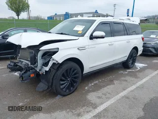 2021 Lincoln Navigator Reserve z VIN 5LMJJ3LT9MEL07595, wystawiony jako IAAI lot #41977779 z przebiegiem 81 088 mil mil oraz . Historia ofert i sprzedaży dostępna na DreamBid. Obrazek 2.
