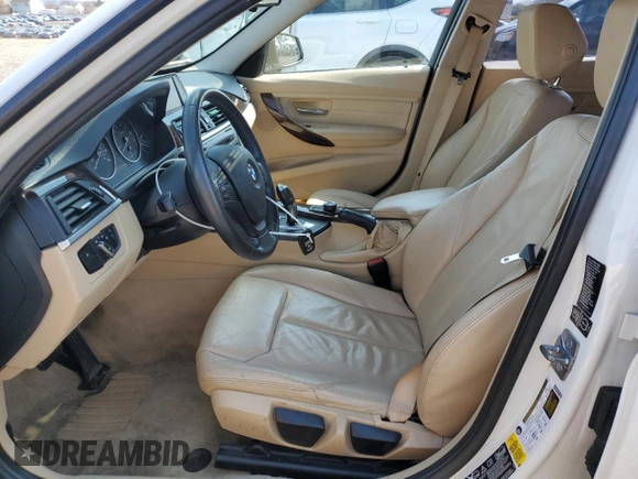 2013 BMW 3 Series 320i xDrive with VIN WBA3C3C5XDF980169, listed as a Copart auction lot 52717675 with 119,297 mi miles and Salvage title. Bid and sale history available at DreamBid. Image 7.