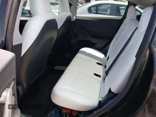 2024 Tesla Model Y with VIN 7SAYGDED9RF191453, listed as a IAAI auction lot 42272051 with 7,805 mi miles and . Bid and sale history available at DreamBid. Image 8.