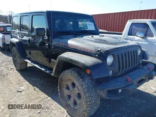 2017 Jeep Wrangler Unlimited Rubicon Recon z VIN 1C4HJWFG0HL737779, wystawiony jako IAAI lot #41396395 z przebiegiem 125 845 mil mil oraz . Historia ofert i sprzedaży dostępna na DreamBid. Obrazek 1.