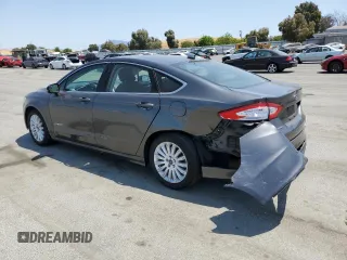 2016 Ford Fusion SE Hybrid with VIN 3FA6P0LU9GR166408, listed as a Copart auction lot 59931995 with 104,560 mi miles and Salvage title. Bid and sale history available at DreamBid. Image 2.