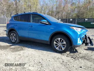 2016 Toyota RAV4 Hybrid XLE with VIN JTMRJREV4GD003211, listed as a Copart auction lot 52111305 with 79,404 mi miles and Salvage Title. Bid and sale history available at carsss.com. Image 4.