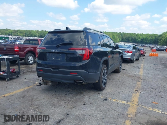 2021 GMC Acadia SLT with VIN 1GKKNMLS0MZ136228, listed as a IAAI auction lot 42445381 with 65,700 mi miles and . Bid and sale history available at DreamBid. Image 4.