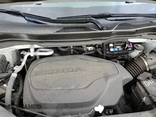 2022 Honda Pilot Elite z VIN 5FNYF6H00NB054108, wystawiony jako Copart lot #64098795 z przebiegiem 46 293 mil mil oraz Szkoda całkowita • Salvage title. Historia ofert i sprzedaży dostępna na DreamBid. Obrazek 16.