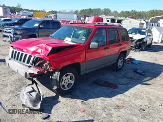 1996 Jeep Grand Cherokee Laredo with VIN 1J4EX58S8TC122302, listed as a IAAI auction lot 41218573 with 195,392 mi miles. Bid and sale history available at carsss.com. Image 17.