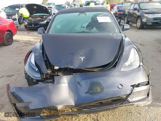 2023 Tesla Model 3 with VIN 5YJ3E1EA9PF569494, listed as a IAAI auction lot 41798014 with 18,372 mi miles. Bid and sale history available at carsss.com. Image 12.
