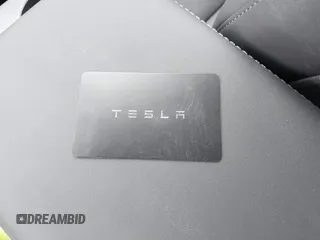 2025 Tesla Model Y Long Range with VIN 7SAYGDEDXSA349480, listed as a IAAI auction lot 41492740 with 1,486 mi miles and . Bid and sale history available at DreamBid. Image 11.