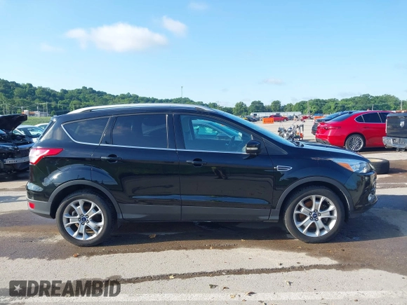 2016 Ford Escape Titanium with VIN 1FMCU9J97GUC21242, listed as a IAAI auction lot 42431567 with 96,946 mi miles and . Bid and sale history available at DreamBid. Image 13.