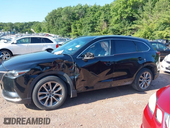 2018 Mazda CX-9 Grand Touring with VIN JM3TCBDYXJ0208962, listed as a IAAI auction lot 42629720 with 123,929 mi miles and . Bid and sale history available at DreamBid. Image 15.
