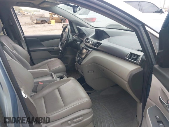 2014 Honda Odyssey Touring with VIN 5FNRL5H91EB081811, listed as a IAAI auction lot 42153920 with 16 mi miles and . Bid and sale history available at DreamBid. Image 5.