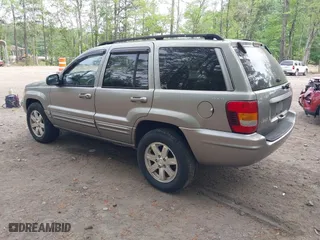 1999 Jeep Grand Cherokee Limited with VIN 1J4GW68N5XC684157, listed as a IAAI auction lot 42104283 with 164,506 mi miles. Bid and sale history available at carsss.com. Image 3.