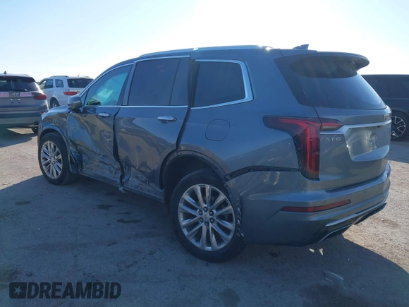 2020 Cadillac XT6 FWD Premium Luxury z VIN 1GYKPCRS8LZ129799, wystawiony jako IAAI lot #41602536 z przebiegiem 96 865 mil mil oraz . Historia ofert i sprzedaży dostępna na DreamBid. Obrazek 3.
