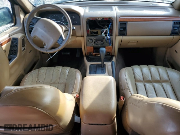1999 Jeep Grand Cherokee Limited with VIN 1J4G268S9XC529466, listed as a Copart auction lot 78732274 with 131,744 mi miles and Salvage title. Bid and sale history available at DreamBid. Image 8.