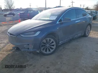 2017 Tesla Model X 90D with VIN 5YJXCDE23HF051321, listed as a IAAI auction lot 41415384 with 127,476 mi miles and . Bid and sale history available at carsss.com. Image 2.