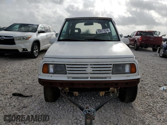 1994 Suzuki Sidekick z VIN 2S3TA01C8R6408593, wystawiony jako Copart lot #65011514 z przebiegiem 248 814 mil mil oraz Tytuł czysty. Historia ofert i sprzedaży dostępna na DreamBid. Obrazek 5.
