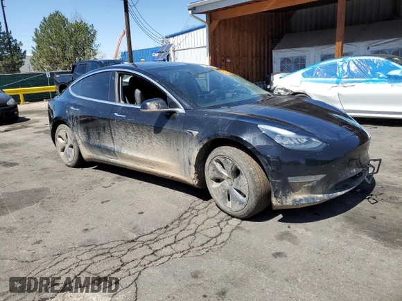 2019 Tesla Model 3 Long Range with VIN 5YJ3E1EB8KF451535, listed as a Copart auction lot 53085105 with 133,928 mi miles and Non Repairable. Bid and sale history available at DreamBid. Image 4.