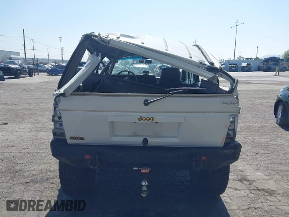 1991 Jeep Cherokee Country z VIN 1J4FJ78S7ML632675, wystawiony jako IAAI lot #42283175 z przebiegiem 116 062 mil mil oraz . Historia ofert i sprzedaży dostępna na DreamBid. Obrazek 16.