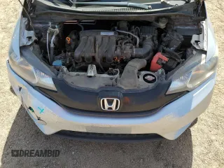 2016 Honda Fit LX z VIN JHMGK5H53GX009541, wystawiony jako Copart lot #56158035 z przebiegiem 260 565 mil mil oraz Szkody całkowita. Historia ofert i sprzedaży dostępna na DreamBid. Obrazek 11.