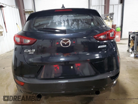 2018 Mazda CX-3 Touring z VIN JM1DKFC75J0301307, wystawiony jako Copart lot #56302175 z przebiegiem 107 676 mil mil oraz Szkoda całkowita • Salvage title. Historia ofert i sprzedaży dostępna na DreamBid. Obrazek 6.