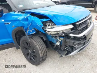 2023 Volkswagen Taos SE z VIN 3VVNX7B23PM344536, wystawiony jako IAAI lot #41069761 z przebiegiem 23 911 mil mil oraz . Historia ofert i sprzedaży dostępna na DreamBid. Obrazek 6.