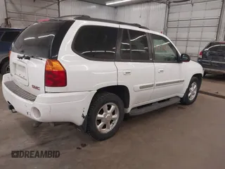 2003 GMC Envoy SLT with VIN 1GKDT13S332222847, listed as a IAAI auction lot 41771052 with 203,699 mi miles. Bid and sale history available at carsss.com. Image 4.