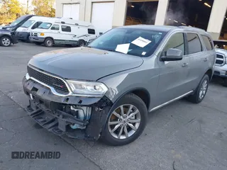2021 Dodge Durango SXT Plus with VIN 1C4RDJAG5MC523158, listed as a IAAI auction lot 41450801 with 68,496 mi miles and . Bid and sale history available at DreamBid. Image 2.