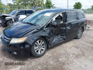 2014 Honda Odyssey Touring with VIN 5FNRL5H94EB057499, listed as a IAAI auction lot 41983956 with 158,573 mi miles and . Bid and sale history available at DreamBid. Image 2.