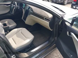 2014 Tesla Model S P85D with VIN 5YJSA1H29EFP63032, listed as a IAAI auction lot 42132145 with Not Provided miles and . Bid and sale history available at DreamBid. Image 5.