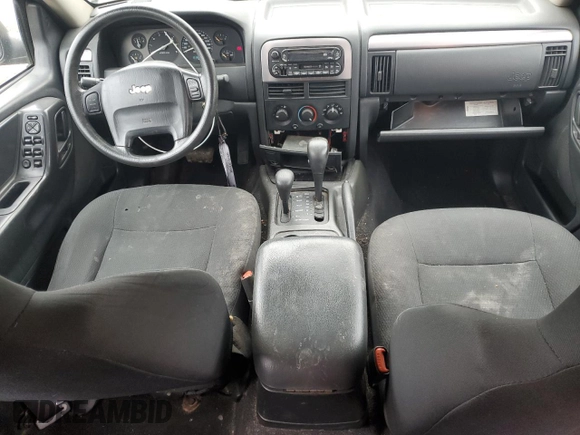 2003 Jeep Grand Cherokee Laredo z VIN 1J4GW48S53C568929, wystawiony jako Copart lot #57604245 z przebiegiem 216 103 mil mil oraz Czysty tytuł • Clean title. Historia ofert i sprzedaży dostępna na DreamBid. Obrazek 8.