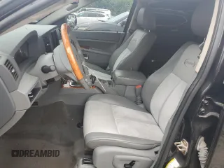 2007 Jeep Grand Cherokee Overland with VIN 1J8HR68227C651830, listed as a Copart auction lot 62403725 with 147,827 mi miles and Salvage title. Bid and sale history available at DreamBid. Image 7.