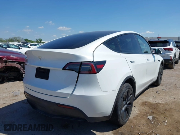 2024 Tesla Model Y with VIN 7SAYGDED0RA327806, listed as a IAAI auction lot 42096752 with 13,244 mi miles and . Bid and sale history available at DreamBid. Image 4.