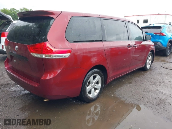 2014 Toyota Sienna L with VIN 5TDZK3DC0ES457242, listed as a IAAI auction lot 42307360 with 86,857 mi miles and . Bid and sale history available at DreamBid. Image 4.