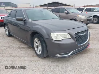 2015 Chrysler 300 Limited with VIN 2C3CCAAG4FH814179, listed as a IAAI auction lot 42058849 with 167,946 mi miles. Bid and sale history available at carsss.com. Image 1.