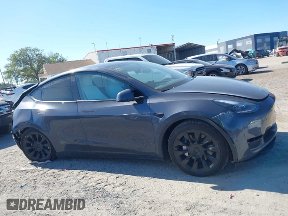 2023 Tesla Model Y Long Range with VIN 7SAYGDEE1PA203937, listed as a IAAI auction lot 41814421 with 9,138 mi miles. Bid and sale history available at carsss.com. Image 12.