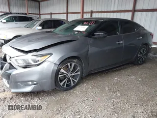 2018 Nissan Maxima Platinum z VIN 1N4AA6AP4JC390235, wystawiony jako IAAI lot #42376364 z przebiegiem 152 293 mil mil oraz . Historia ofert i sprzedaży dostępna na DreamBid. Obrazek 2.