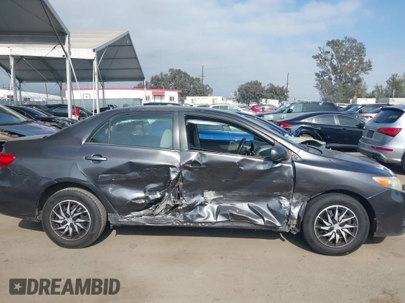 2011 Toyota Corolla L with VIN JTDBU4EE3BJ090749, listed as a IAAI auction lot 42106633 with 209,824 mi miles. Bid and sale history available at carsss.com. Image 14.