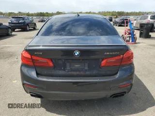 2018 BMW 5 Series M550i xDrive with VIN WBAJB9C57JB286734, listed as a Copart auction lot 52711235 with 127,450 mi miles and Salvage title. Bid and sale history available at DreamBid. Image 6.