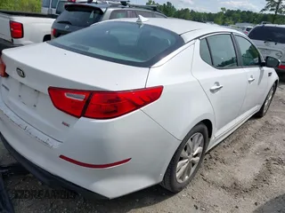 2015 Kia Optima LX z VIN 5XXGM4A76FG399865, wystawiony jako IAAI lot #42312813 z przebiegiem 207 747 mil mil oraz . Historia ofert i sprzedaży dostępna na DreamBid. Obrazek 4.