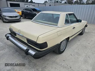 1987 Mercedes-Benz 560 with VIN WDBBA48D5HA061899, listed as a Copart auction lot 76554184 with 68,292 mi miles and Salvage Title. Bid and sale history available at carsss.com. Image 4.