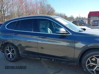 2018 BMW X1 xDrive28i z VIN WBXHT3C31J3H31737, wystawiony jako IAAI lot #41698670 z przebiegiem 68 017 mil mil oraz . Historia ofert i sprzedaży dostępna na DreamBid. Obrazek 14.