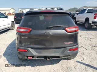 2014 Jeep Cherokee Trailhawk with VIN 1C4PJMBS1EW304718, listed as a Copart auction lot 64105485 with 151,315 mi miles and Salvage title. Bid and sale history available at DreamBid. Image 6.