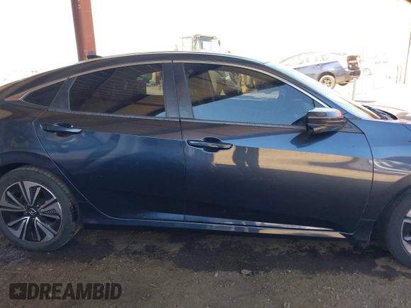 2018 Honda Civic EX-L z VIN JHMFC1F8XJX033602, wystawiony jako IAAI lot #42161015 z przebiegiem 99 597 mil mil oraz . Historia ofert i sprzedaży dostępna na DreamBid. Obrazek 13.